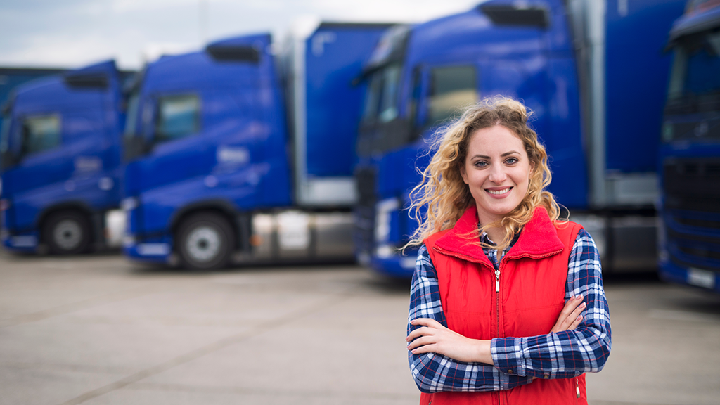 Woman in front of truck fleet