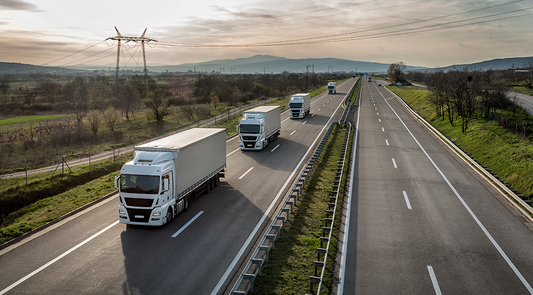 Three trucks on the highway